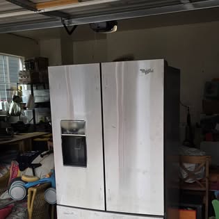 Fridge out of a packed garage